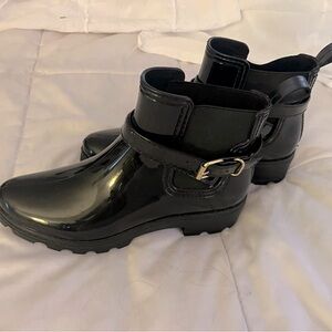 Women’s patent leather rain boots.